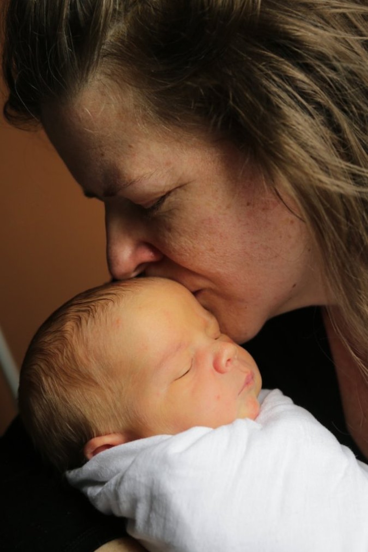 a woman holds a baby