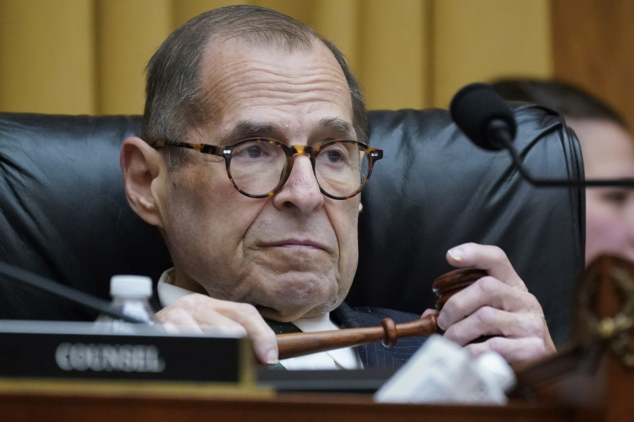 Nadler holds a gavel and leans back in his chair.
